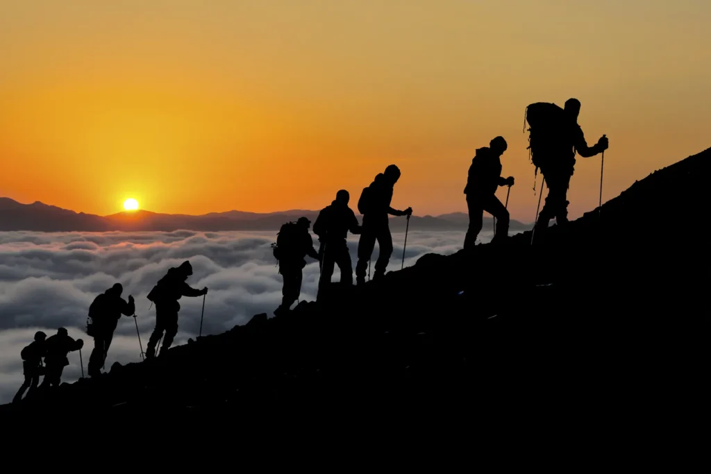 climbing mount kilimanjaro at sunset